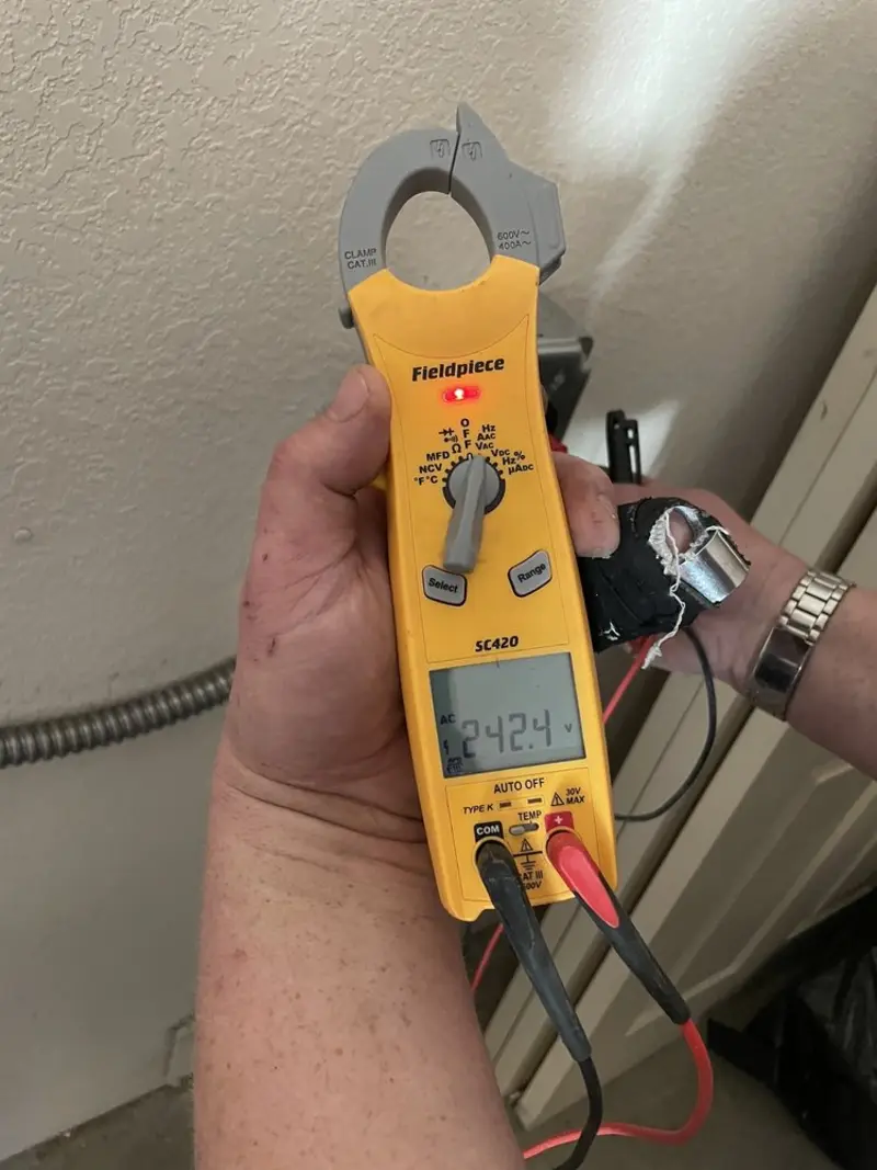 Voltage testing with clamp meter during Recessed Lighting Installation in Little Falls